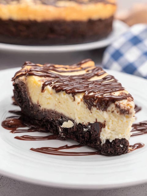 A slice of brownie bottom cheesecake.