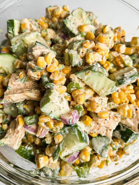A bowl of street corn creamy cucumber salad.
