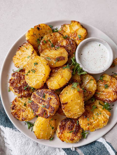 A plate of Parmesan potatoes.
