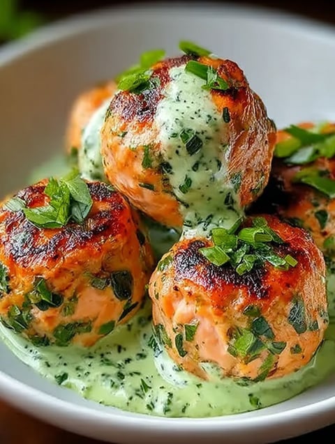 Salmon balls with creamy avocado sauce.
