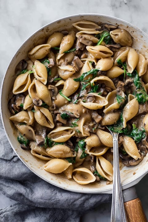 A bowl of creamy vegan mushroom pasta.
