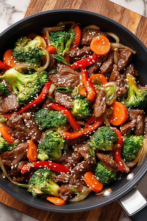 A beef stir fry with broccoli and carrots.