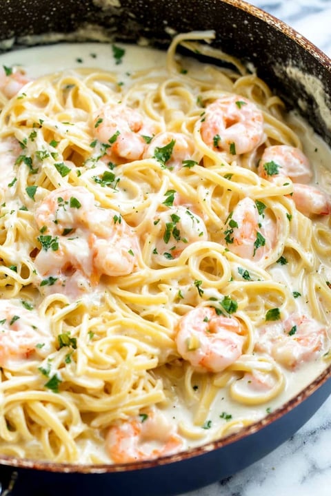 A bowl of shrimp alfredo.